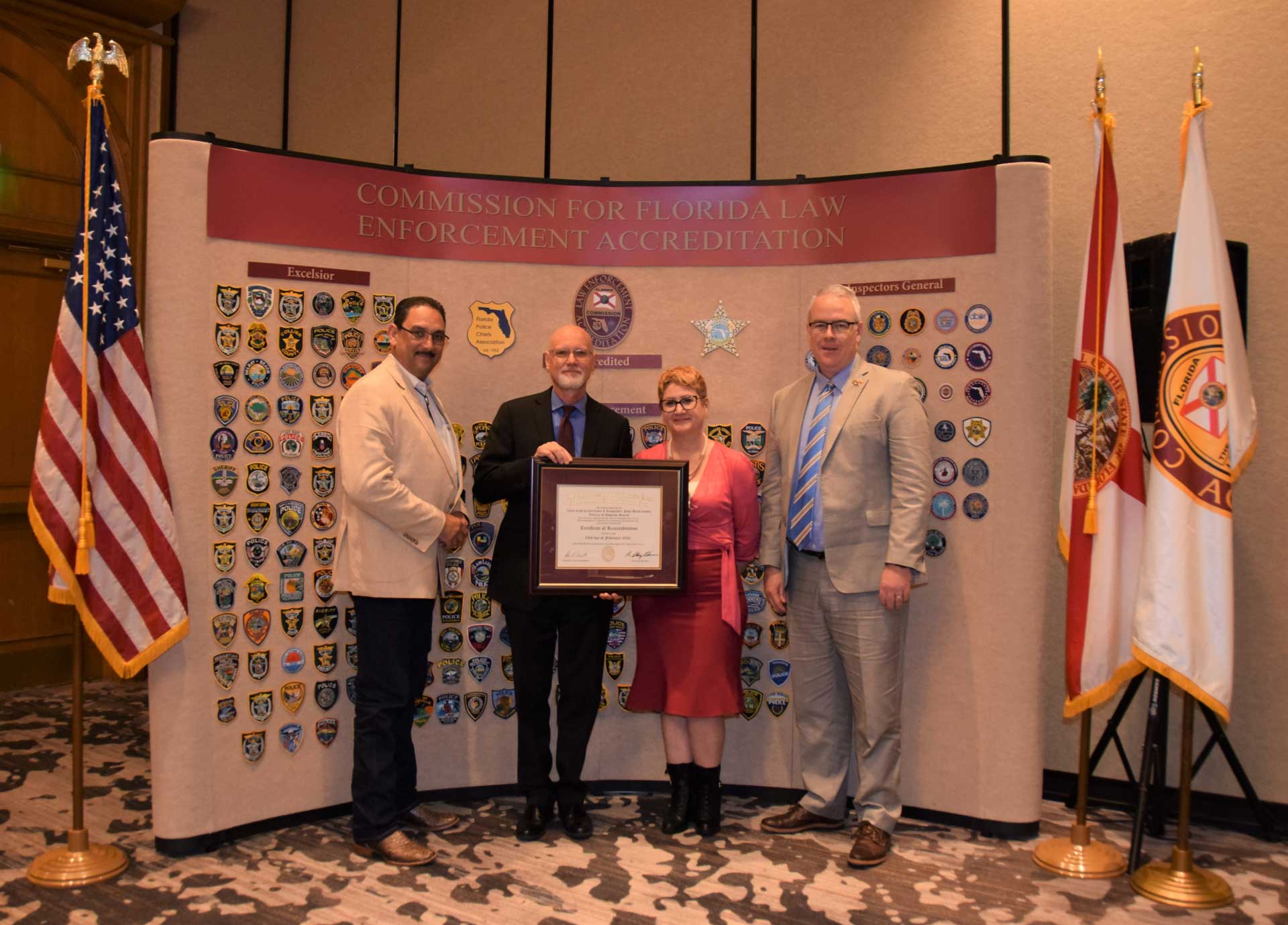 Clerk staff accept accreditation from the Commission for Florida Law Enforcement Accreditation